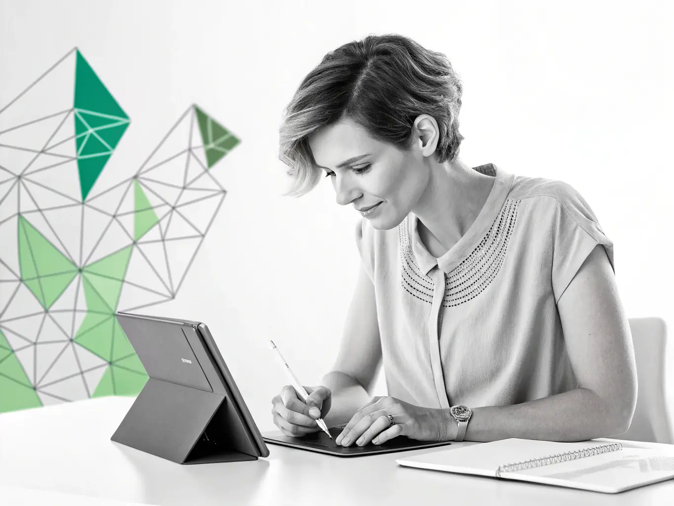 A designer working on a futuristic interface on a digital tablet with vibrant visuals, showcasing SamyLabs' UI/UX design capabilities.